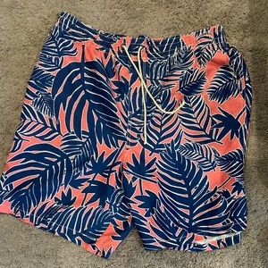 Coral and navy swim trunks